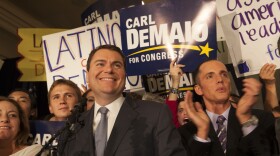 Carl DeMaio and his partner Johnathan Hale surrounded by DeMaio's supporters on election night at the U.S. Grant in downtown San Diego, Nov. 4, 2014.
