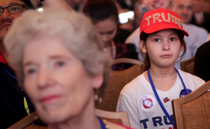 A young girl listens to Republican presidential candidate Donald Trump address the Values Voter Summit on September 9 in Washington, DC.