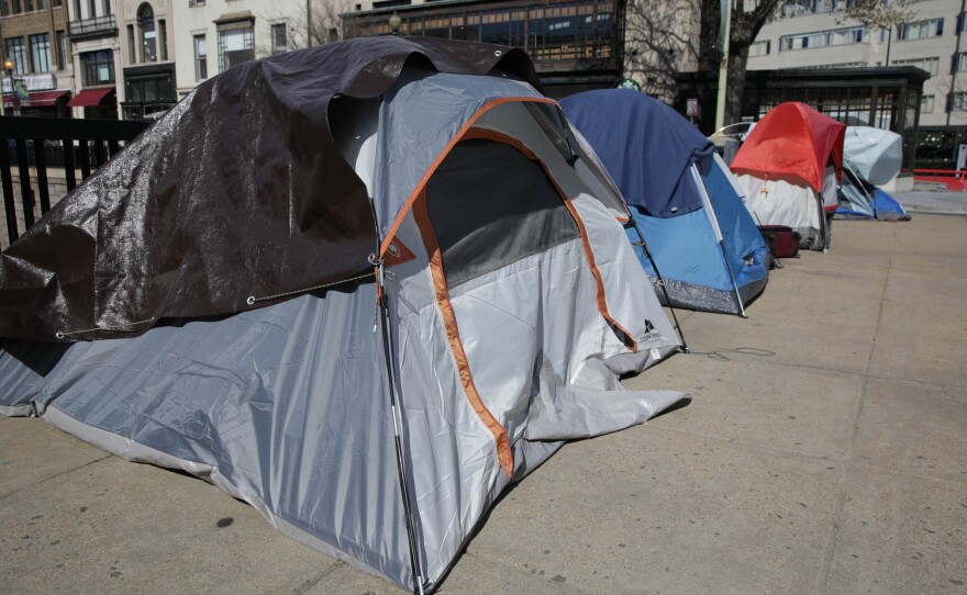 Tents of homeless people line a street in Washington, D.C., in April.