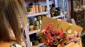 Holley Simmons, owner of the flower shop She Loves Me based in Washington, D.C., displays the grocery store-bought bouquet.