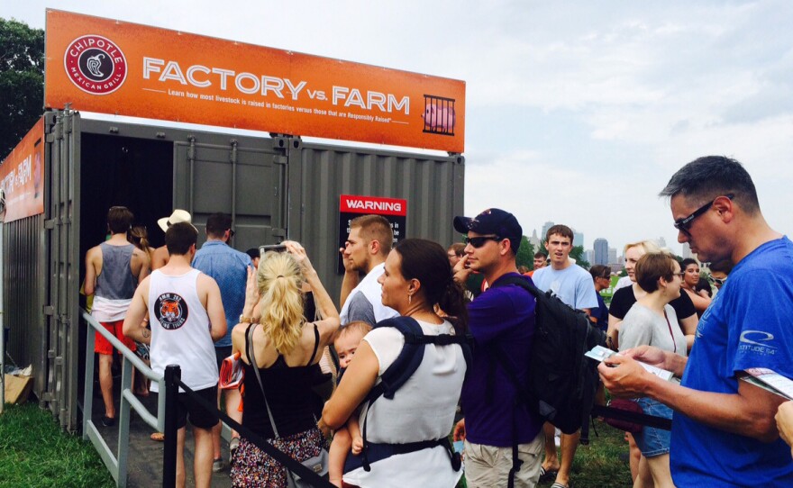 Waiting in line for an exhibit at the Chipotle Cultivate Festival on factory farming. Festival goers had to visit four such exhibits to get a free burrito.