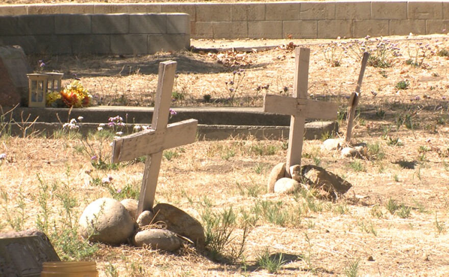 Ken Kramer uncovers the history of a small graveyard by Highway 56 in Carmel Valley, San Diego, Calif.