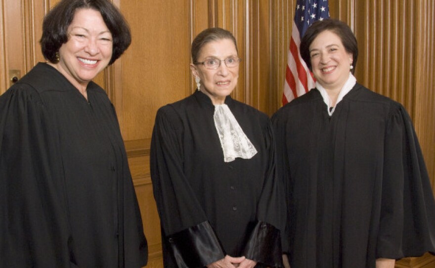 This photo provided by the Supreme Court shows (from left) Justices Sonia Sotomayor, Ruth Bader Ginsburg and Elena Kagan in the Justices' Conference Room on Oct. 1, before Kagan's investiture ceremony.