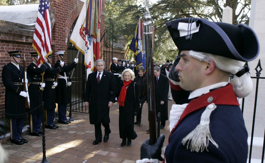 President George W. Bush laid a wreath at George Washington's tomb in Mount Vernon, Va., on the 275th anniversary of his birth, Feb. 19, 2007. Bush is accompanied by Gay Hart Gaines of the Mount Vernon Ladies' Association. Washington set a tradition for early presidents with a modest funeral on his family property. Today's presidential funerals are national events planned by a military task force.