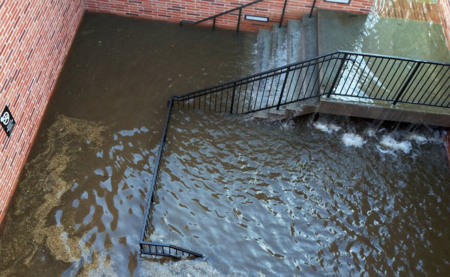 Water filled the stairs to a parking structure adjacent to the main entry doors of Pauley Pavilion, home of UCLA basketball, after a 30-inch water main burst on nearby Sunset Boulevard Tuesday.