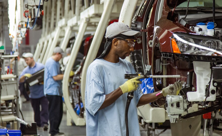 Workers assemble Volkswagen Passat sedans at the German automaker's plant in Chattanooga, Tenn., on June 12, 2013. The automaker announced a new policy Wednesday that would allow interaction with labor unions at the plant.