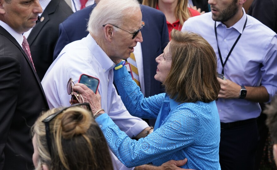 President Biden greets House Speaker Nancy Pelosi at the White House Congressional Picnic, held just before he left for Israel on Tuesday.