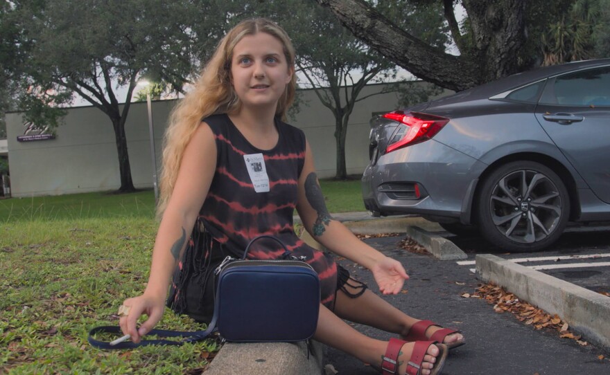 Ella Glendining sits outside hospital in USA