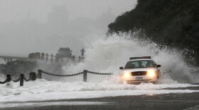 A wave crashes over a U.S. Park Police patrol car January 20, 2010 at Fort Point in San Francisco California. 