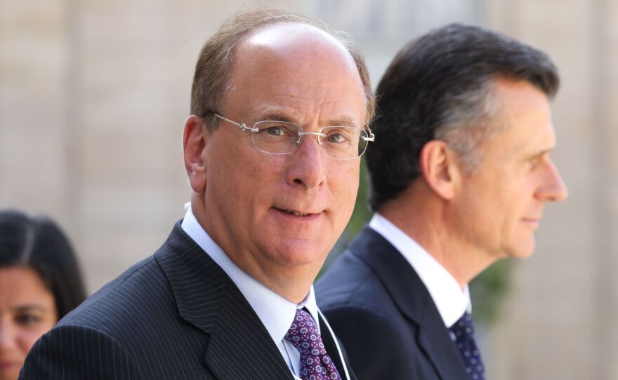 BlackRock Chairman and CEO Larry Fink, seen here in Paris in July, wrote in his annual letter to CEOs that climate change will soon cause "a significant reallocation of capital."