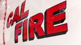 A Cal Fire decal is seen on the side of one of the state agency's vehicle. 