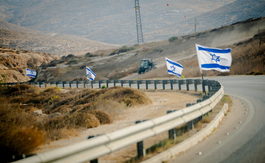 An Israeli settler drives an all-terrain vehicle along Route 317 in the South Hebron Hills, near Masafer Yatta in the occupied West Bank, on Sept. 24, 2026.