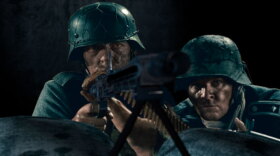 Reconstruction of two Germans firing an MG 42 machine gun at the troops on the beaches.