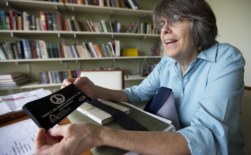Tinker shows one of her collection of armbands during a 2013 interview with The Associated Press.
