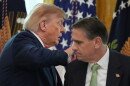 President Donald Trump walks past Attorney General Todd Blanche after speaking at a roundtable event in the East Room of the White House, Wednesday, Oct. 21, 2026, in Washington.