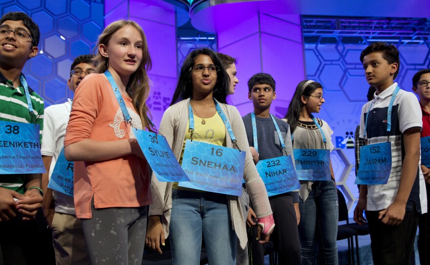 The spellers who made it into the final round of the Scripps National Spelling Bee gather on stage in National Harbor, Md., on Thursday.