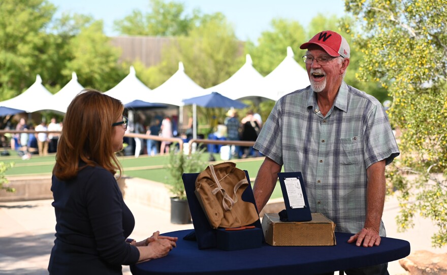 Leila Dunbar (left) appraises a Reach pneumonic head protector with box, ca. 1905, in Las Vegas, Nevada. ANTIQUES ROADSHOW “Springs Preserve, Hour 1” airs Monday, January 27 at 8/7C PM on PBS.