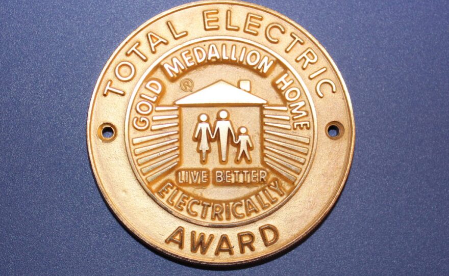 A gold medallion issued by the National Electric Manufacturers Association was once use to promote all-electric homes.