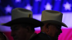 Men arrive at a campaign rally for Mitt Romney in Elko, Nev., on Friday. 