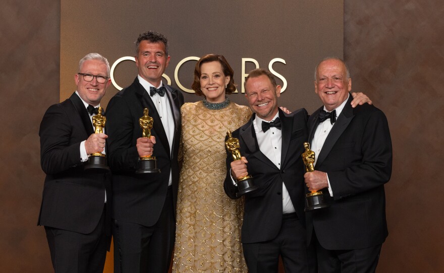 Daniel Barrett, Eric Saindon, Sigourney Weaver, Richard Baneham, and Joe Letteri pose backstage with the Oscar® for Visual Effects during the 98th Oscars® at Dolby® Theatre at Ovation Hollywood on Sunday, March 15, 2026.