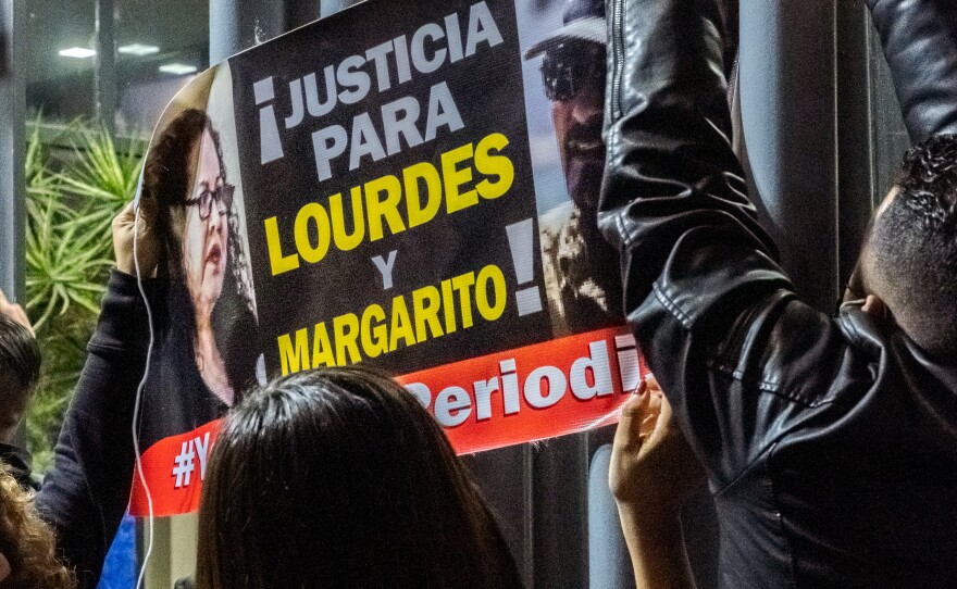 Protesters hung signs on the gates to the Mexican federal prosecutor's office in Tijuana demanding "Justice for Lourdes and Margarito", two Tijuana based journalists murdered less than a week apart, January 25, 2022.
