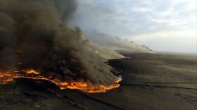 An oil fire in Al Qayyarah, Iraq. In “Battle For Iraq,” FRONTLINE goes inside the battle for Mosul, with civilians, soldiers and ISIS suspects. Guardian reporter Ghaith Abdul-Ahad examines the fight and its toll, surviving a suicide bomb. 
