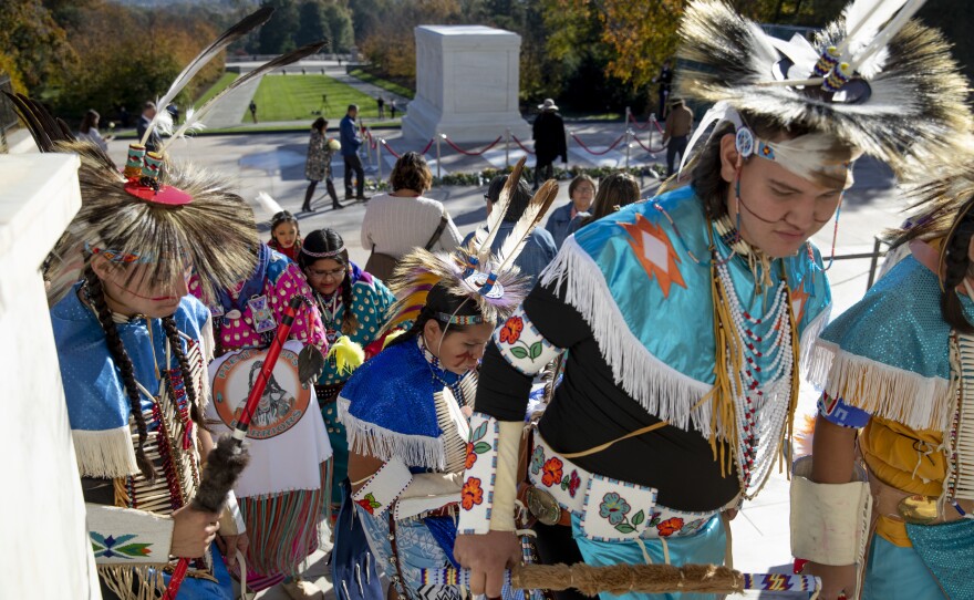 Members of the Crow Nation, who had performed and laid flowers at the Tomb, exit the site.