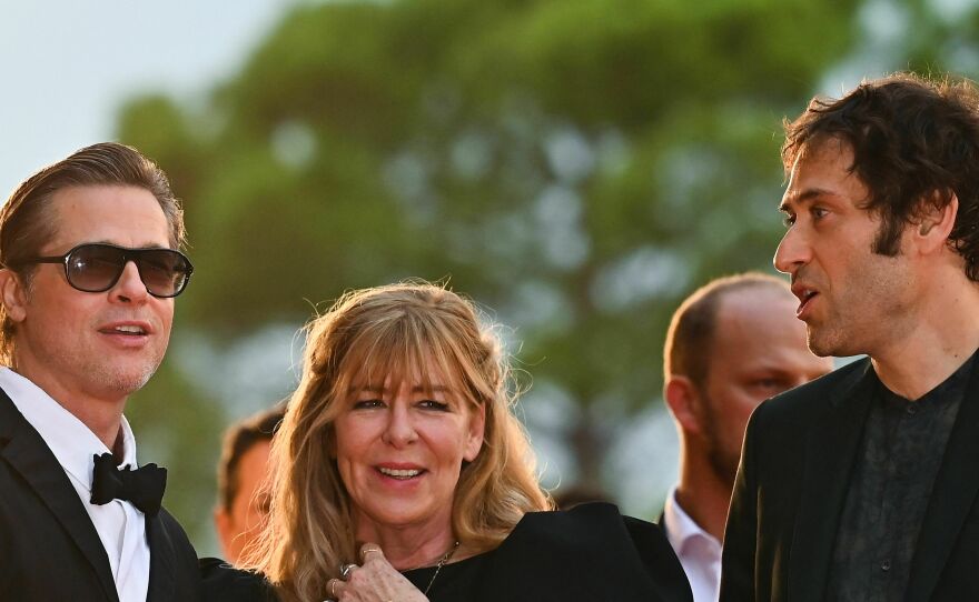 Brad Pitt, left, Dede Gardner and Jeremy Kleiner arrive for a screening of <em>Blonde </em>in Venice in September 2022.