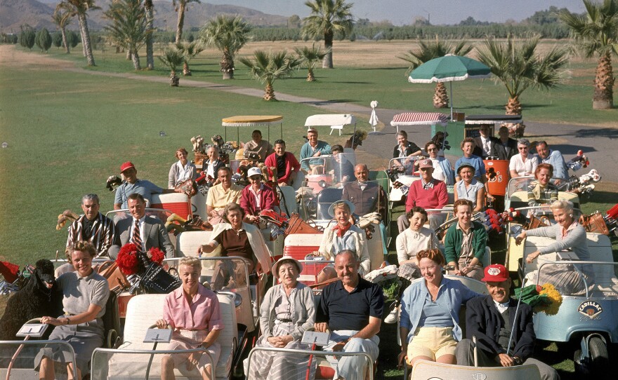 Players pose at the Thunderbird Golf Club, in Palm Springs, Calif., in 1956, when golf carts were first gaining popularity.