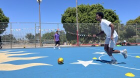 Khalid Hassan dribbles a soccer ball at Colina Del Sol Park's basketball courts, July 10, 2025.