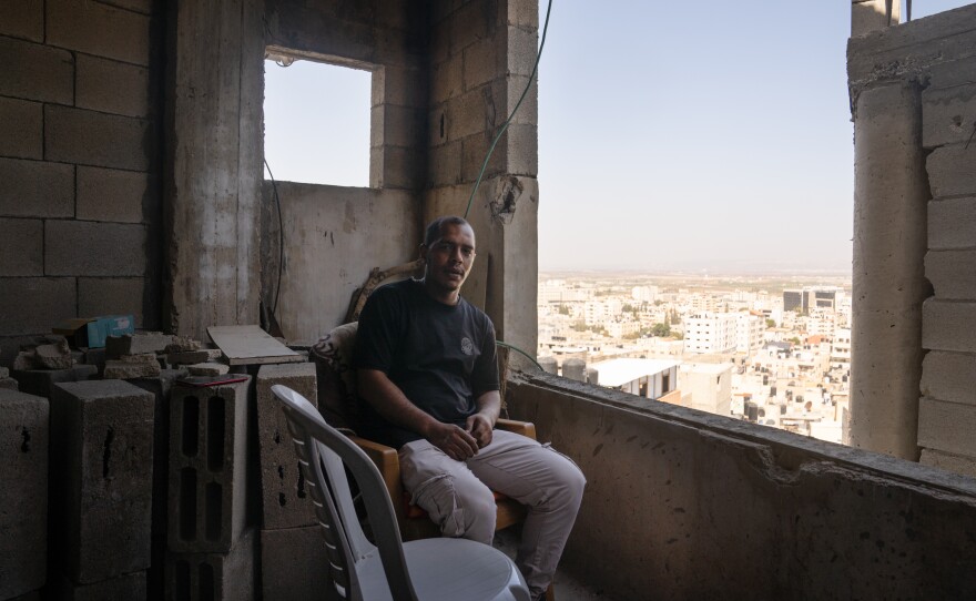 Noor Damaj sits where he was on the night of the Israeli airstrike that hit the mosque next to his home in Jenin.