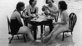 A group of women having tea in a swimming pool at Hornsey from July 1935.