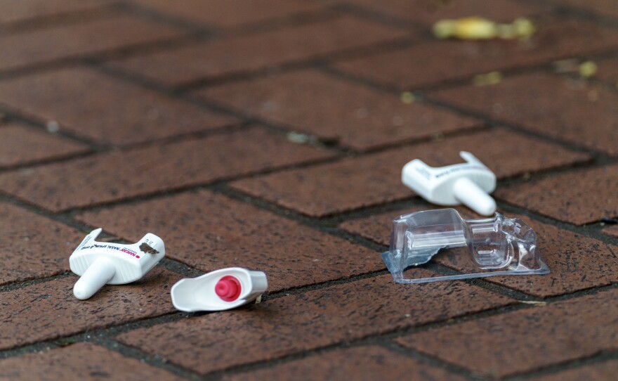 A used Narcan bottle lays on the ground in Portland, Ore.