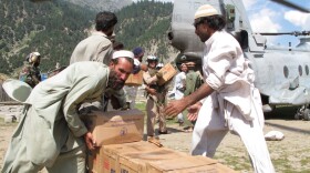Cooking oil, flour, high-energy biscuits and baby food are unloaded from a U.S.  Marine helicopter in a village in the upper Swat Valley that remains cut off nearly six  weeks after the start of the flooding.  In the northwest corner of  Pakistan flood waters swept away the  bridges that were the lifeline for this mountainous and stream filled area.