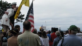 People listen to former Republican House Speaker Newt Gingrich speaking at the Tea Party Express rally in San Diego on October 21, 2010.
