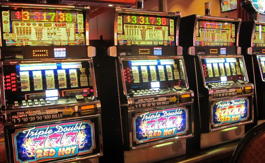 In this June 23, 2021 photo, a row of slot machines sit empty at Bally's casino in Atlantic City N.J.