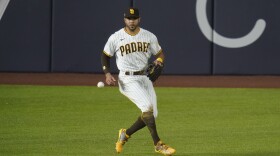 San Diego Padres left fielder Tommy Pham chases down a ball in Game 3 of a baseball National League Division Series against the Los Angeles Dodgers Thursday, Oct. 8, 2020, in Arlington, Texas.