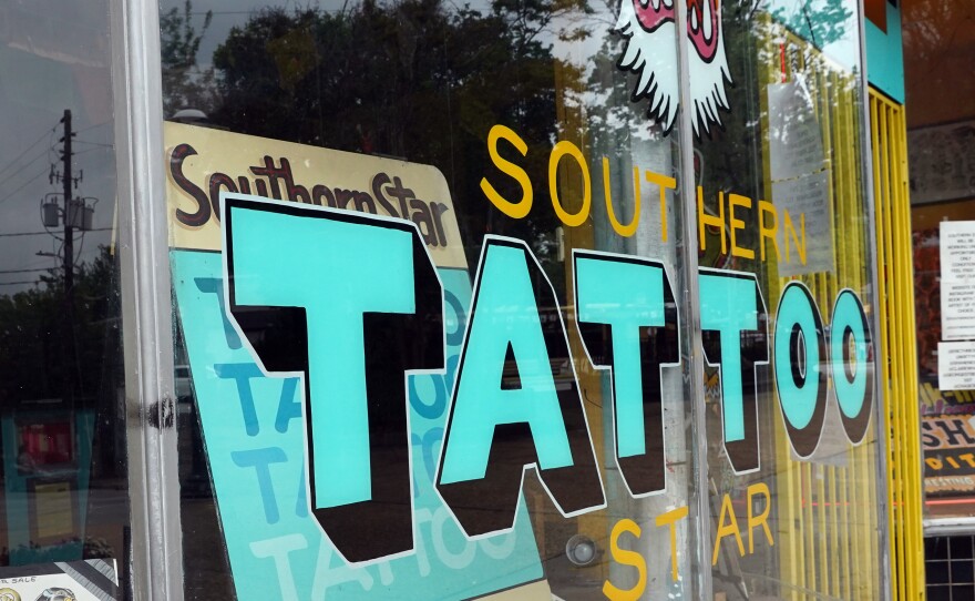 Southern Star Tattoo in Atlanta seen Thursday. Georgia Gov. Brian Kemp is easing restrictions to reopen the state's economy starting Friday.