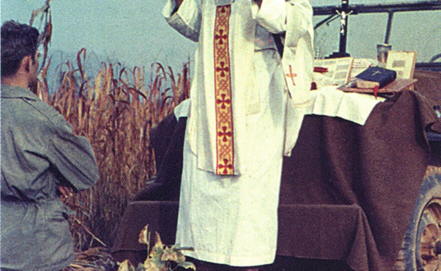 In a photo released by the Catholic Diocese of Wichita, Kapaun says Mass in the field during the Korean War.