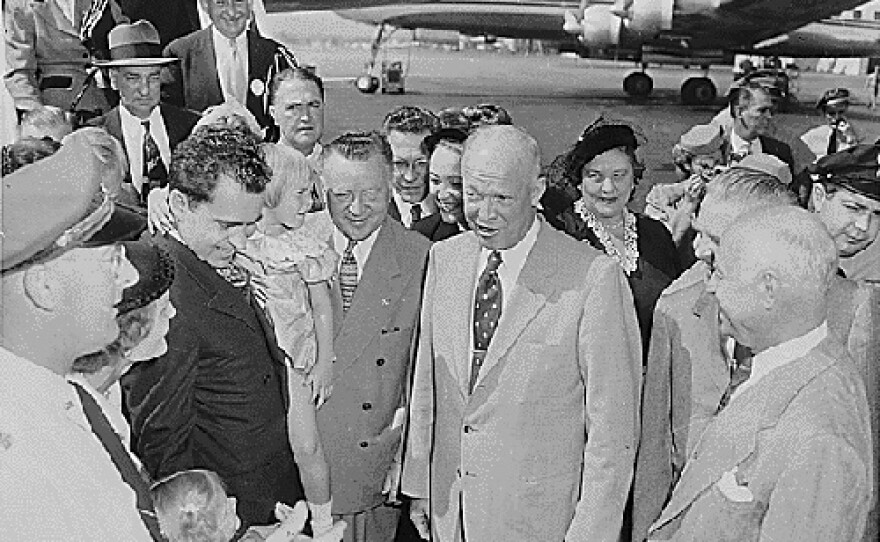 Richard and Pat Nixon introduce General Dwight D. Eisenhower—Richard Nixon's running mate—to their daughters Tricia (standing) and Julie (carried by her father), Washington National Airport, Sept. 10, 1952.