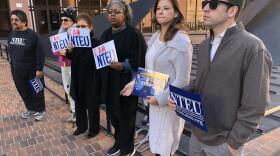 Members of National Treasury Employees Union Chapter 92 stand outside the federal building, Jan. 21, 2019.