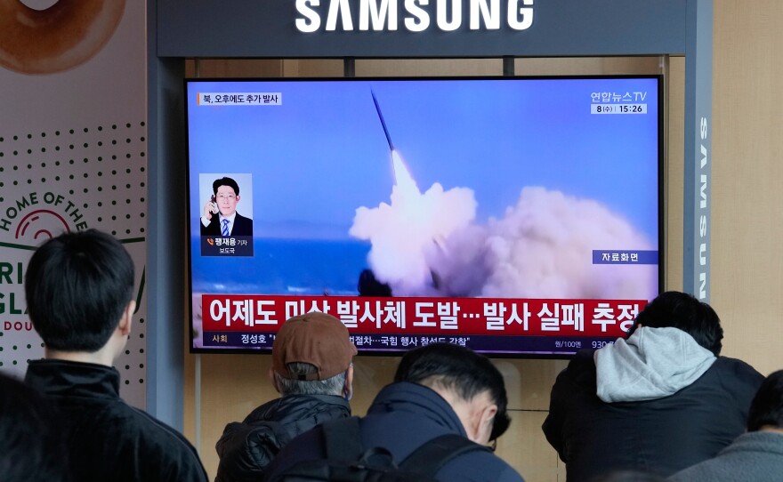 A TV screen shows a file image of North Korea's missile launch during a news program at Seoul Railway Station in Seoul, South Korea, Wednesday, April 8, 2026.