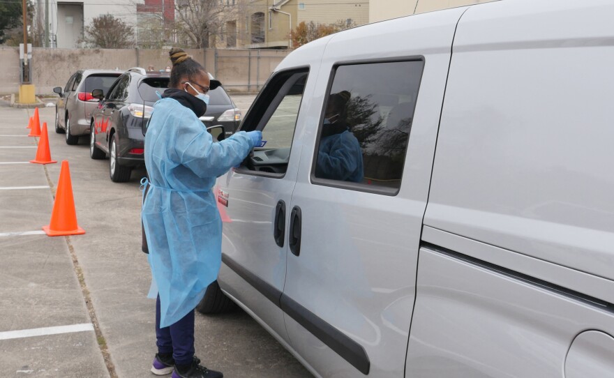 People arrive at a COVID-19 testing station in Houston, Texas, on Jan. 7. Texans were rushing to get tested as the state experienced an unprecedented spike in infections from the omicron variant.