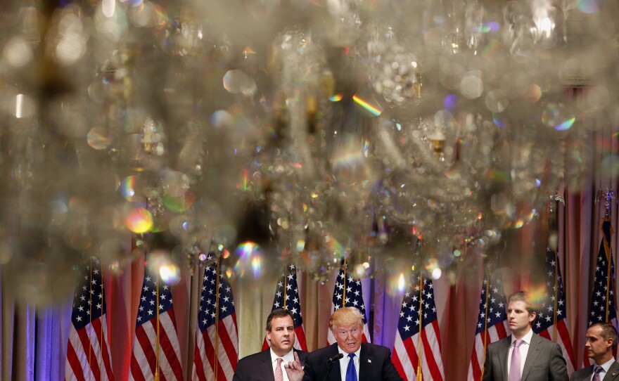 Donald Trump speaks onstage as New Jersey Gov. Chris Christie (left) stands nearby during a Super Tuesday night event at Trump property Mar-a-Lago in Palm Beach, Fla.