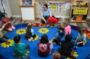 Family educator Lisa Benson-Nuyen addresses her students in a circle in the Northern Lights classroom at the Meadow Lakes CCS Early Learning, a Head Start center, in Wasilla, Alaska, in 2024. The center has since closed because of a lack of staff and money.