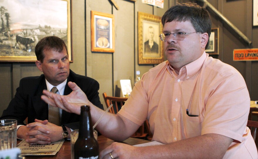 Dr. Shane Avery (right) and Kevin Collins, Scott County's coroner, say the prescription opioid problem in their community has led to an HIV outbreak that's still expanding.