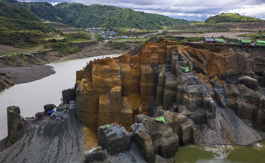Miners dig for jade on a government-licensed site.