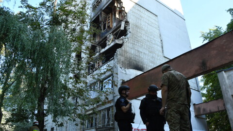 Rescuers work at the damaged apartment building following a Russian air attack in Lviv, Ukraine, Thursday, July 30, 2026.