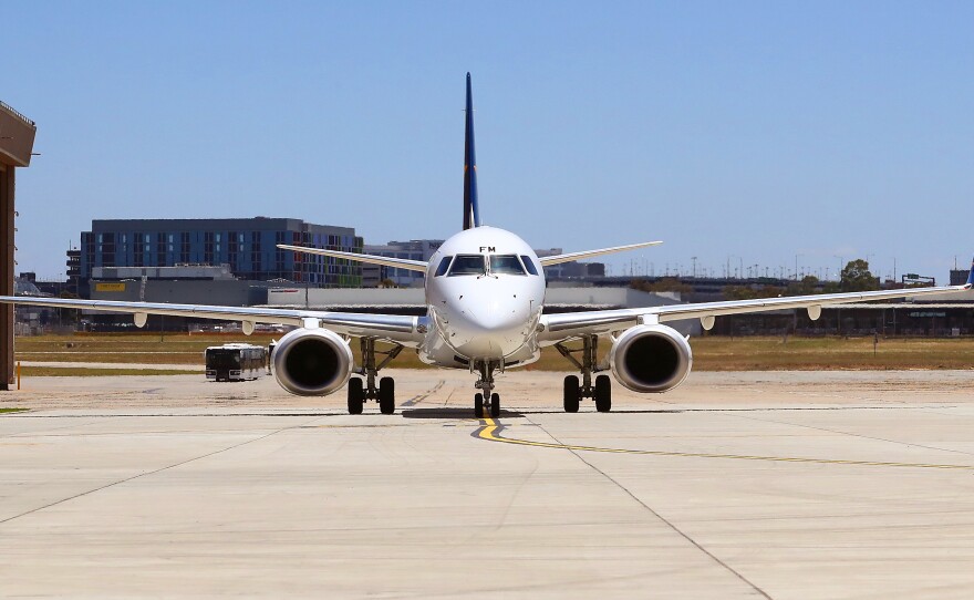 A plane sits at Melbourne Airport in December, ahead of the Australian Open. The country will reopen its international borders to visa holders and fully vaccinated travelers on Feb. 21.