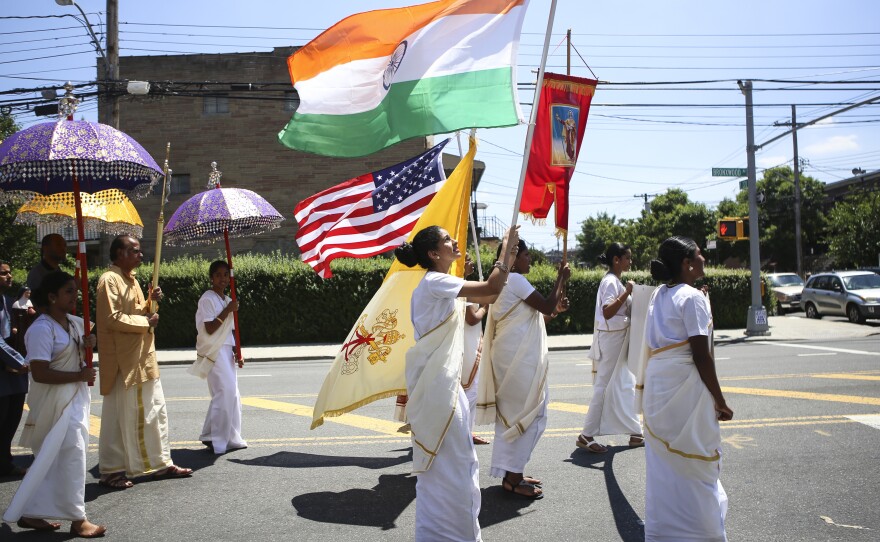 Parishioners parade around the St. Thomas church on the Feast Day of St. Thomas the Apostle last summer, flying the American flag alongside the Indian flag.